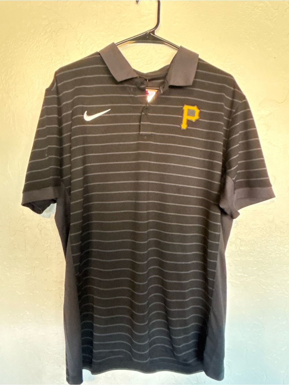 Nike Men’s Black Polo with Thin Gray Stripes and Yellow 'P' Patch